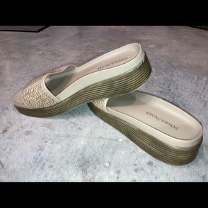 Tiny fabric rip on back right heel,but very hidden